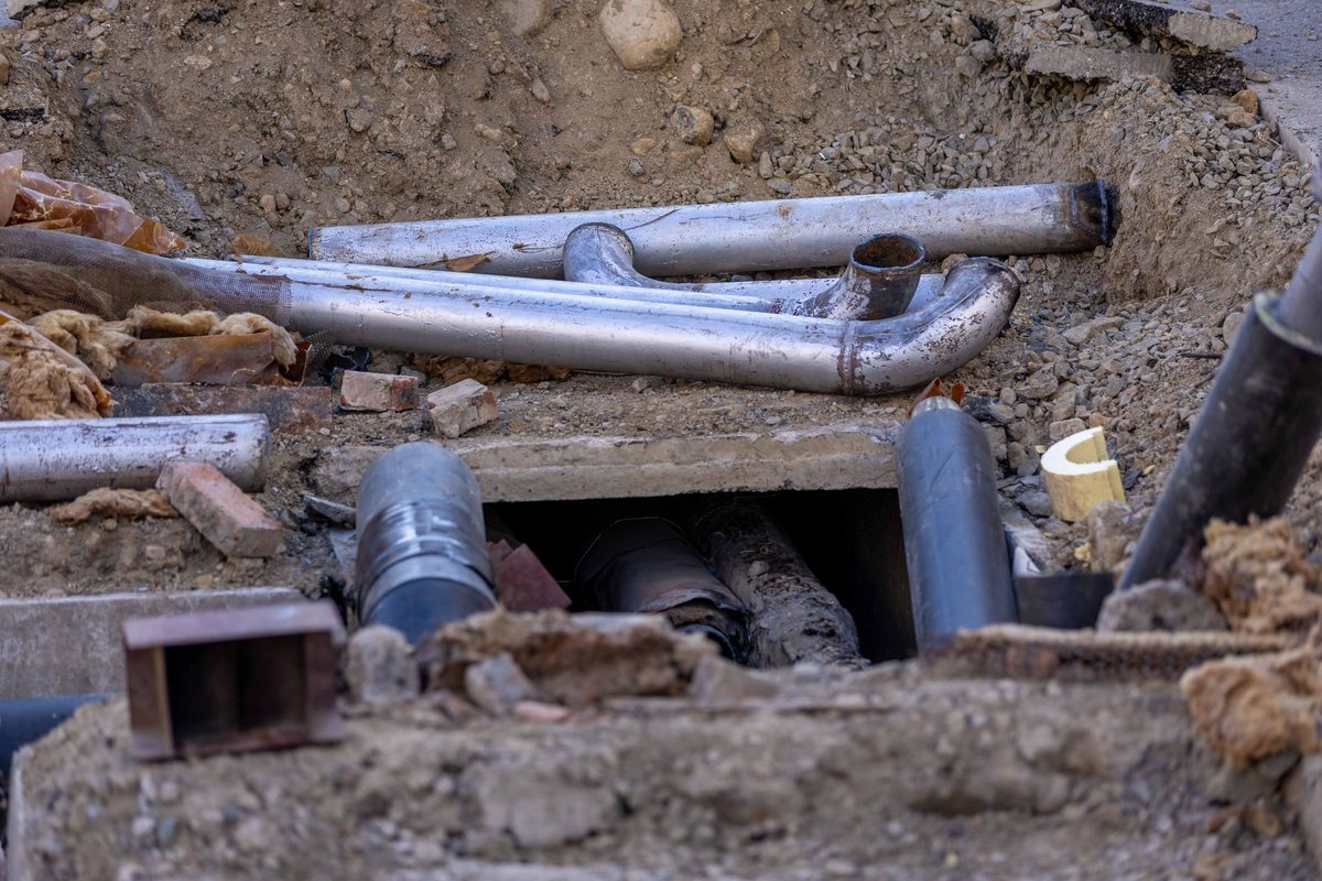 Pipes laid in an open excavation at a construction site